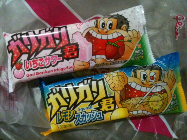 two japanese candy bars sitting next to each other