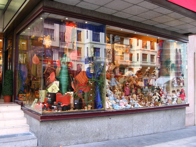 a window display showing a variety of stuffed animals
