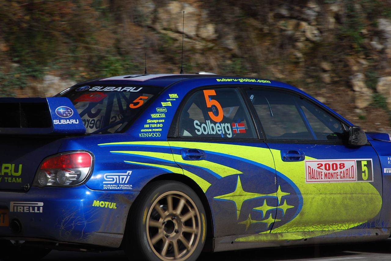 the subaru racing car in action during an event