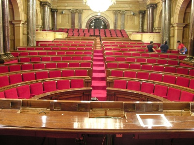 an empty auditorium full of seats and chandeliers