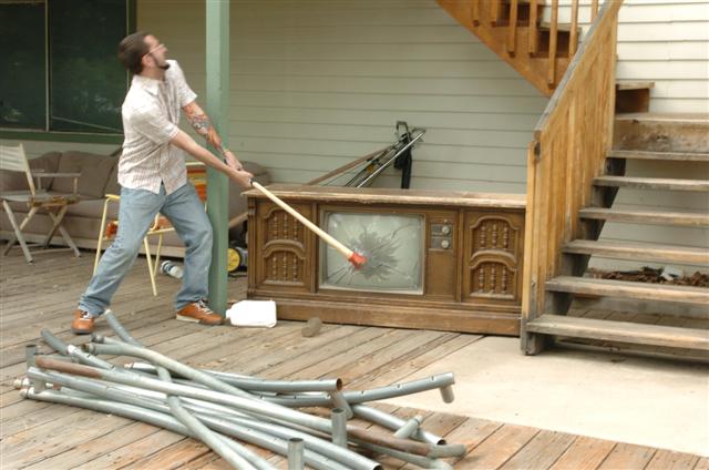 a man is trying to make a mess on the patio