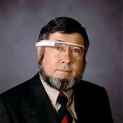 man in business suit wearing google glasses