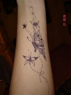 a tattoo that shows the erfly and a erfly flying in it