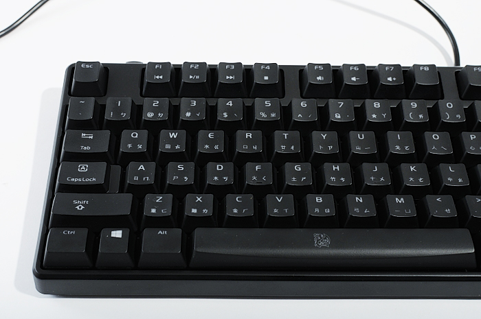 the computer keyboard is black and has no keys on it