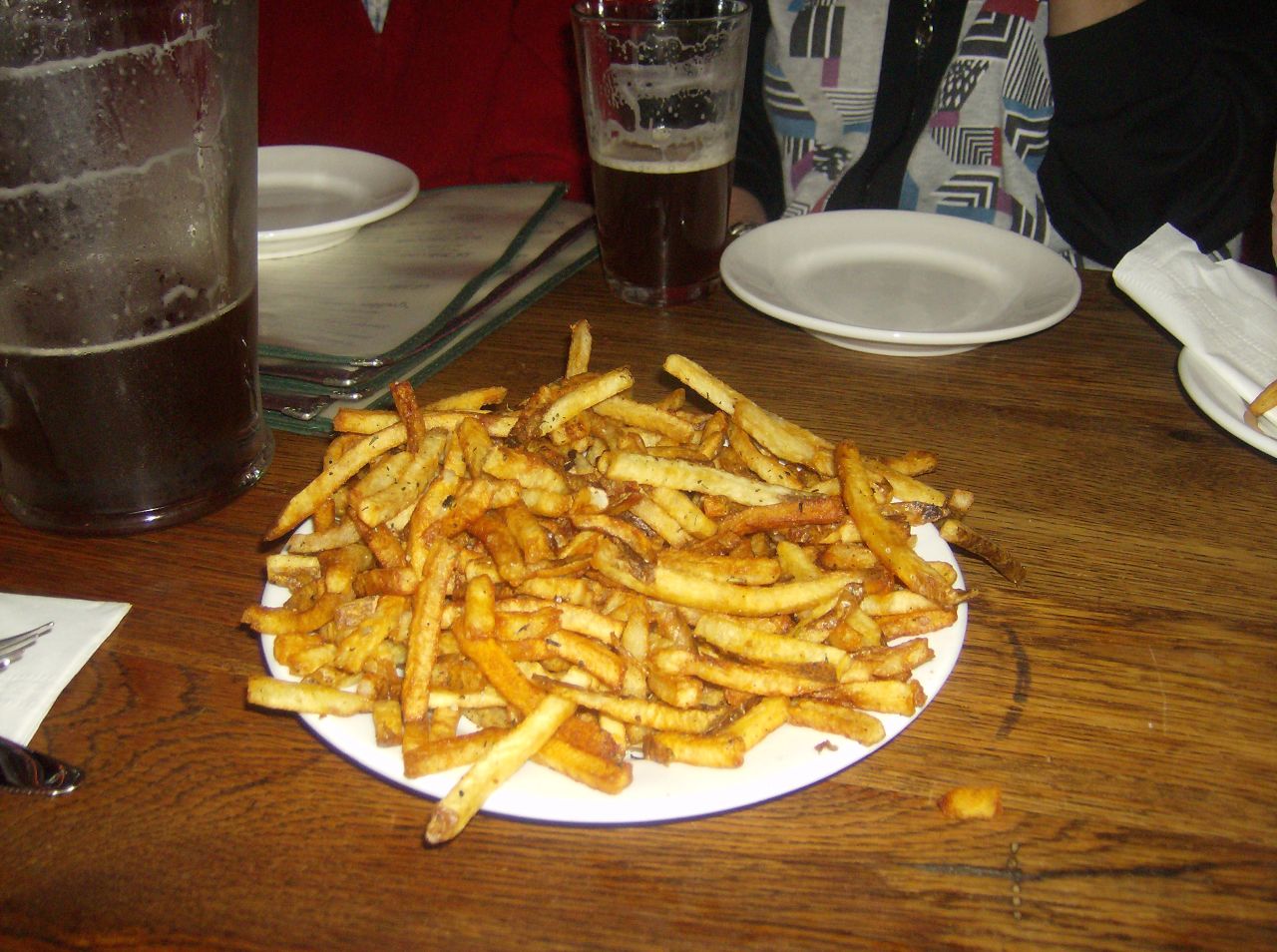 there are many small fries on the plate