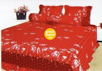 a bed covered in red and white polka dot bedding