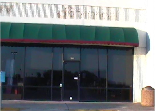 a storefront displaying some doors and windows