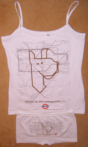 the new london underground shirt is laying on a table