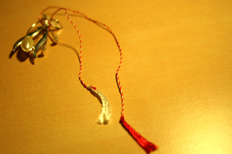 a string connected to two pairs of scissors