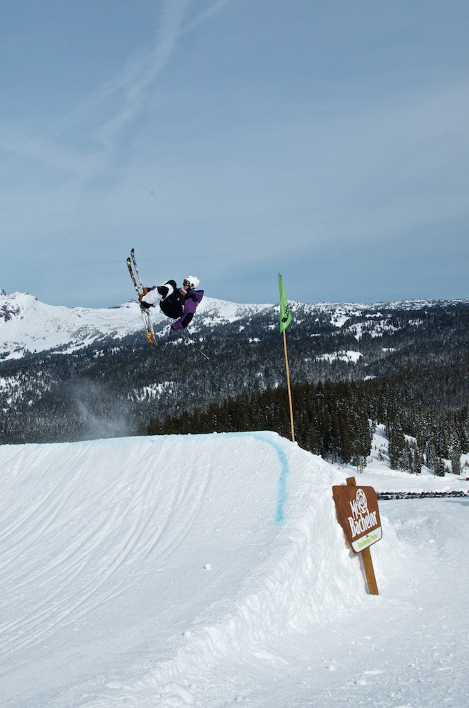 a person doing tricks in the air on their snow board