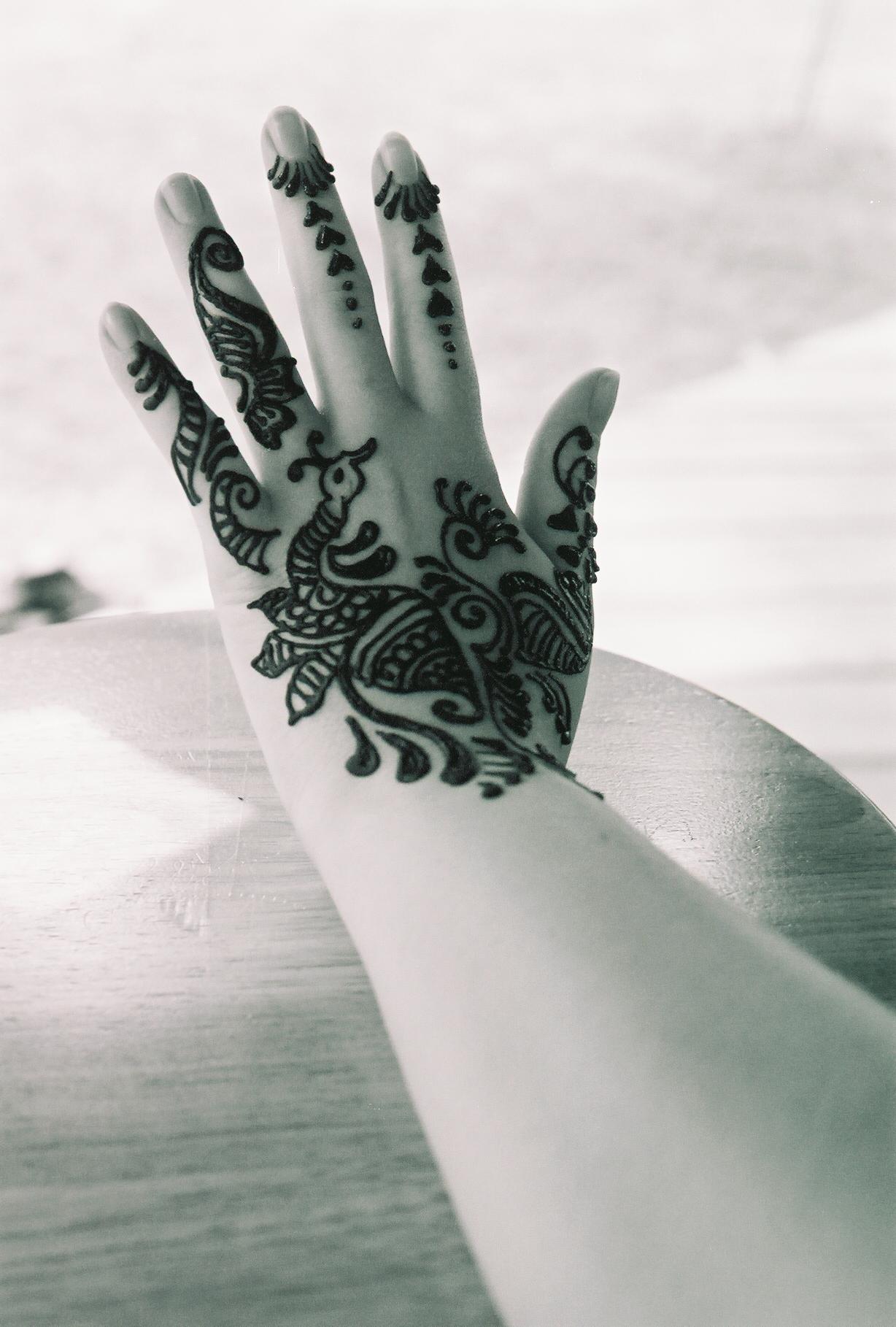 a person's hand with hendi mehndi on it