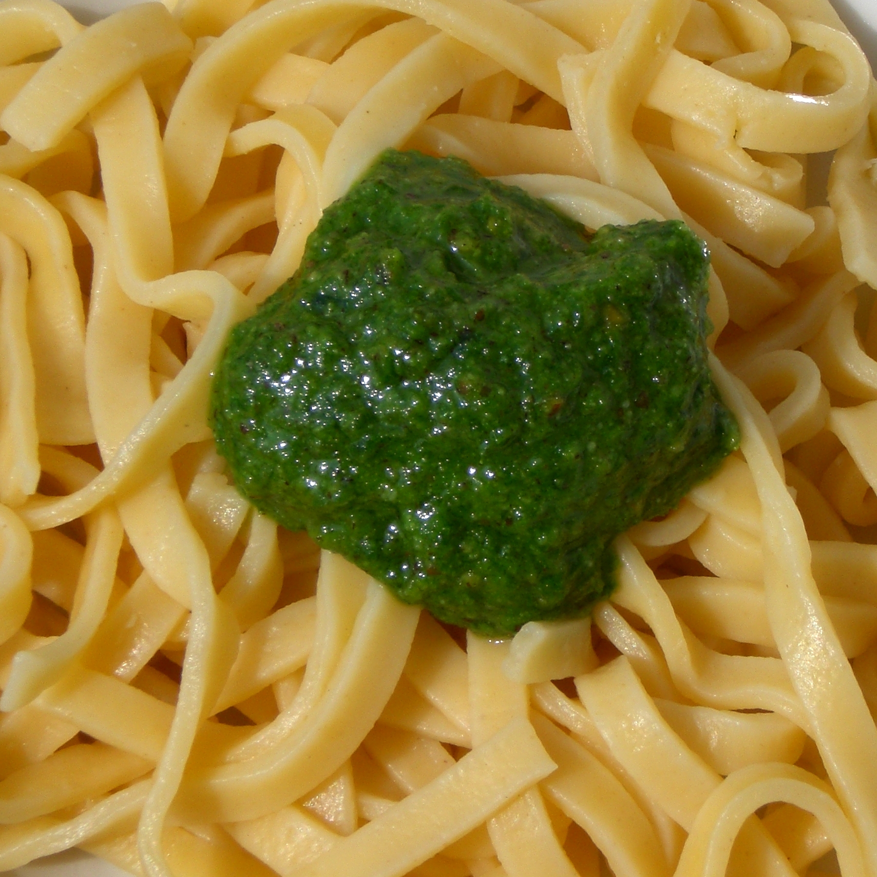 pasta with pesto sauce in a plate