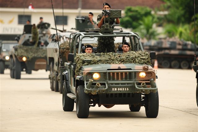 military vehicle with soldiers sitting in the back