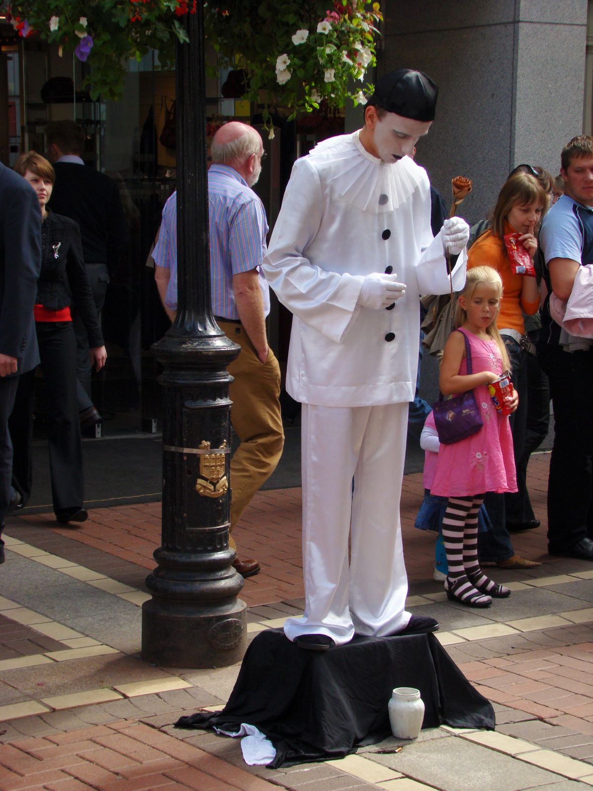 a statue is decorated with a man in white