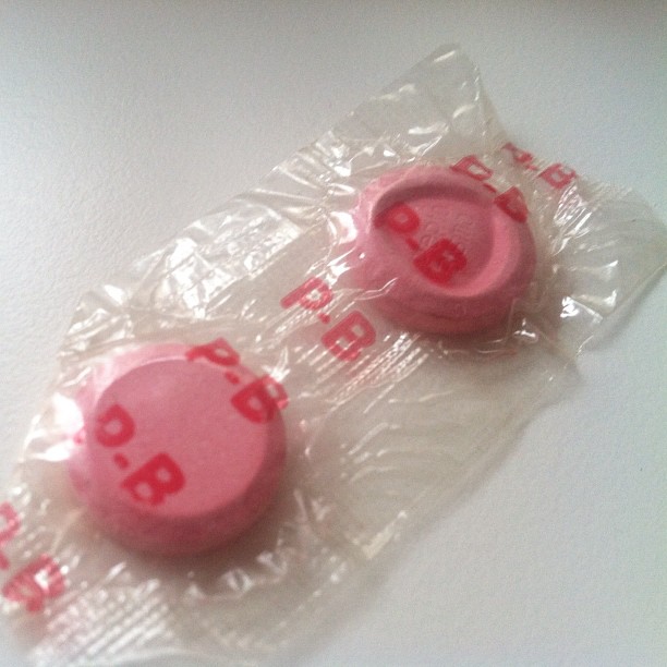 two pink plastic stop ons in packaging