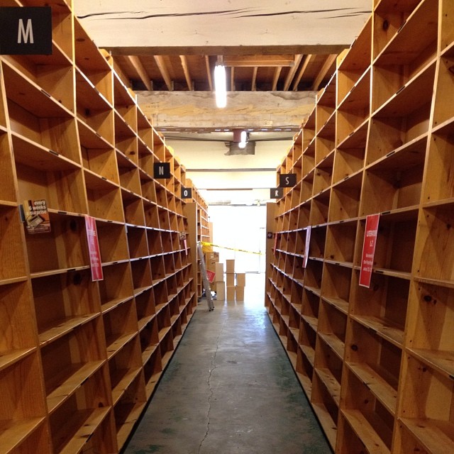 many shelves full of different books that are open