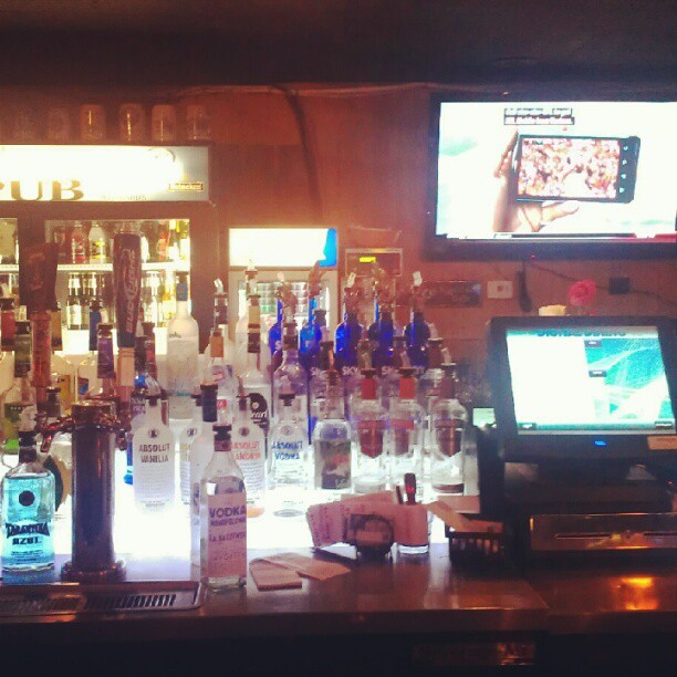an arrangement of liquor bottles on the bar