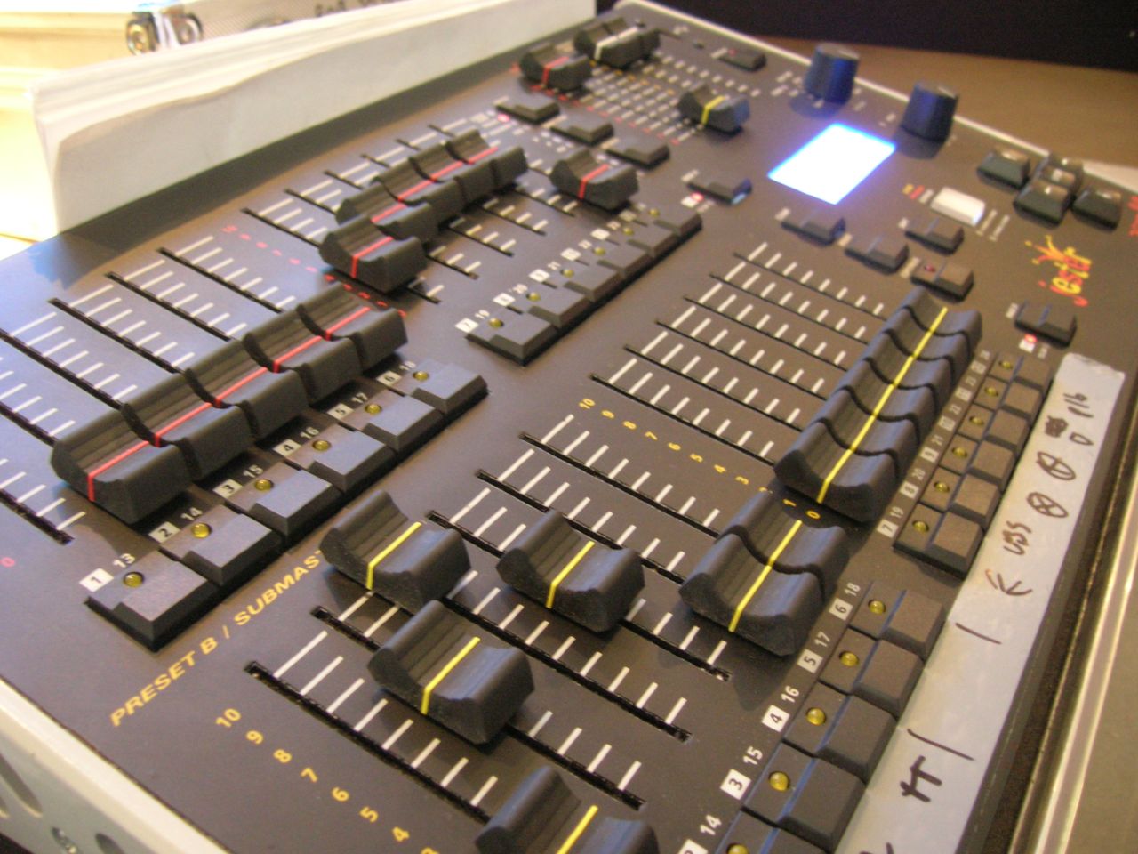 a mixing board with all kinds of s and lights on it