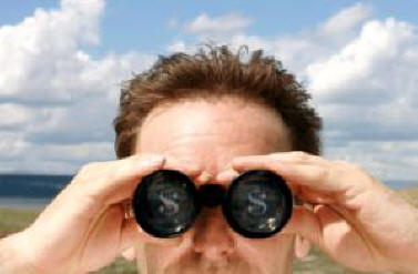 a man is looking through binoculars to look into the sky