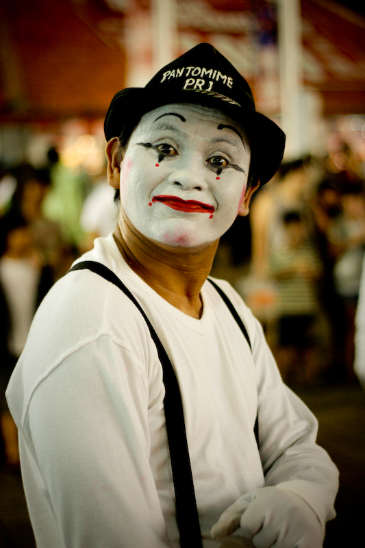 a young person dressed as a clown, posing for a picture