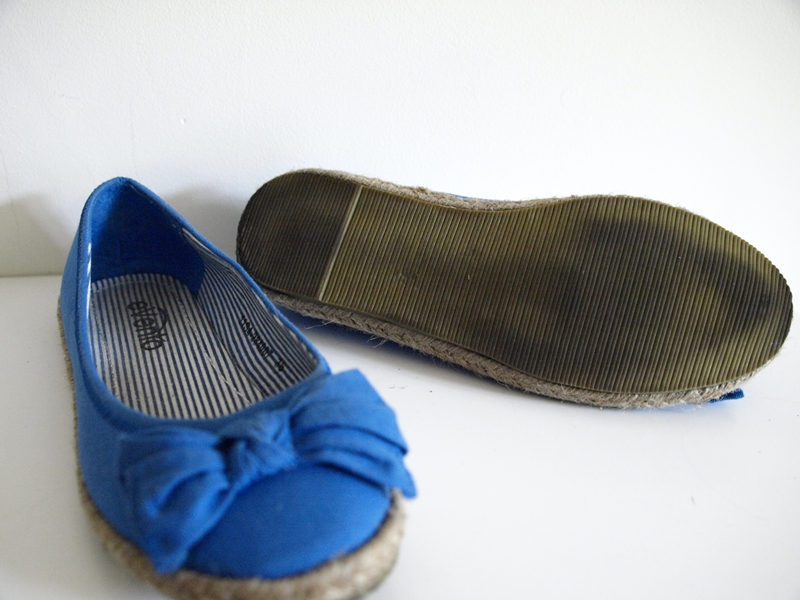 blue shoes that have a bow on the sole