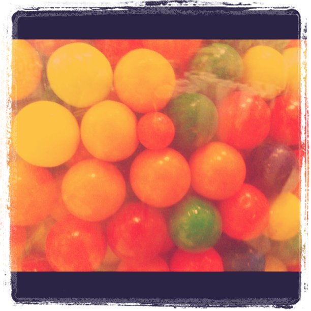 the colorful gummy balls are piled together