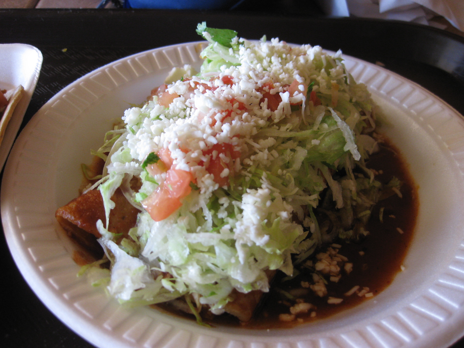 a plate with cabbage covered with sauce and rice