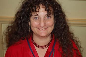 a woman wearing a red shirt and smiling