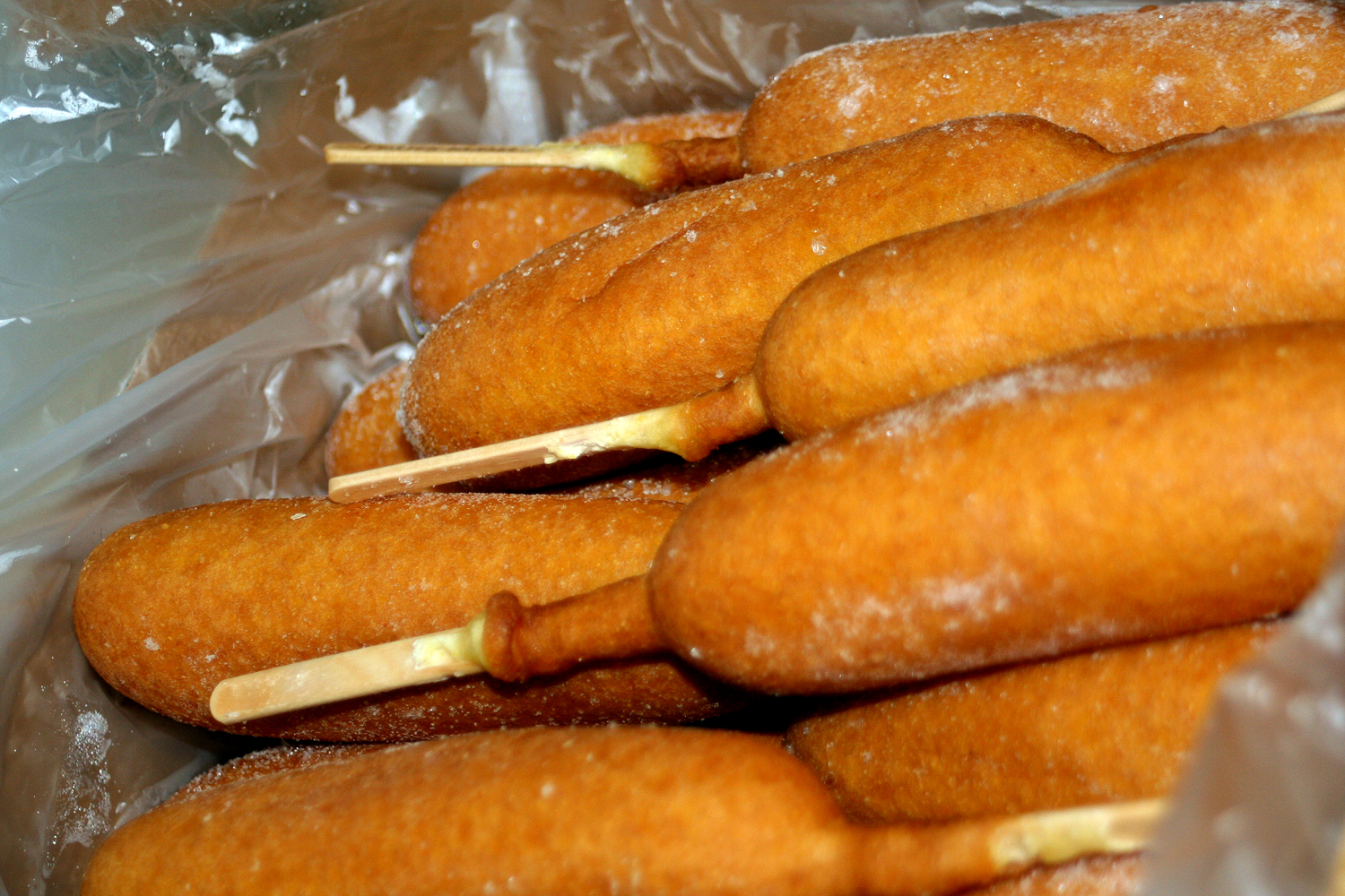 there are some donuts that have been skewered with toothpicks