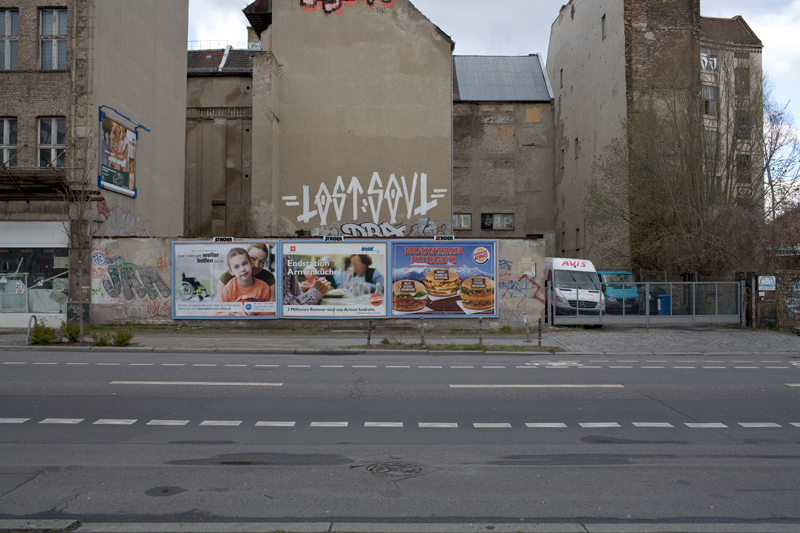 a large building with graffiti on the side of it