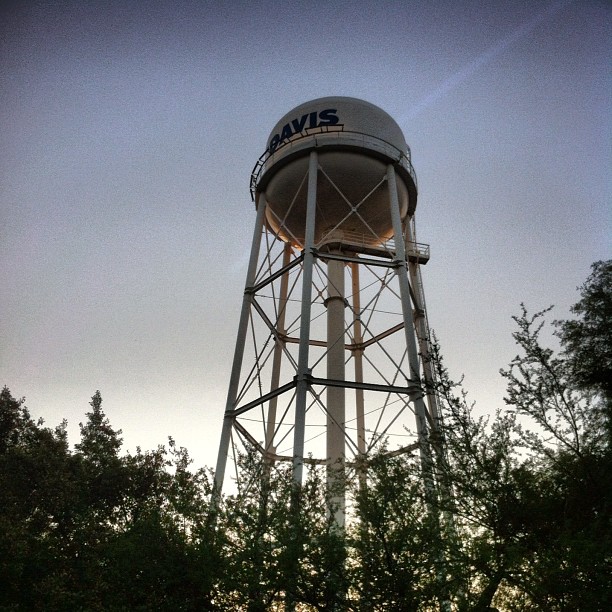 a large gray water tower with the word davis on it