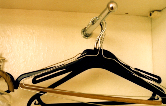 there is a pair of ironed clothes hangers attached to the wall