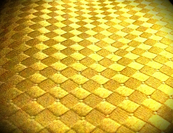an odd looking checkerboard pattern made from scratchs and sponge