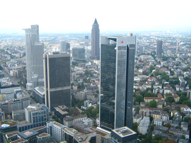 several large tall buildings in a city from the sky