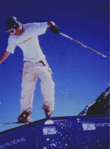 a man snowboarding on top of a purple wall