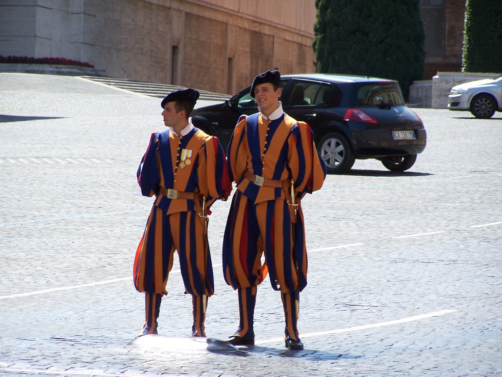 two young men are dressed up and standing outside in costume