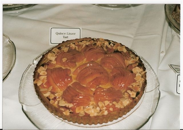 a dessert is displayed on a plate with the label of a business on it