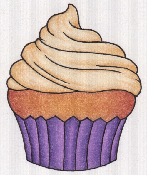 a cupcake that is in some kind of colored paper