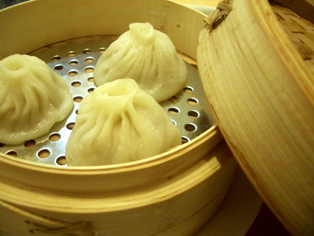 steamed dumplings are set in a steamer basket