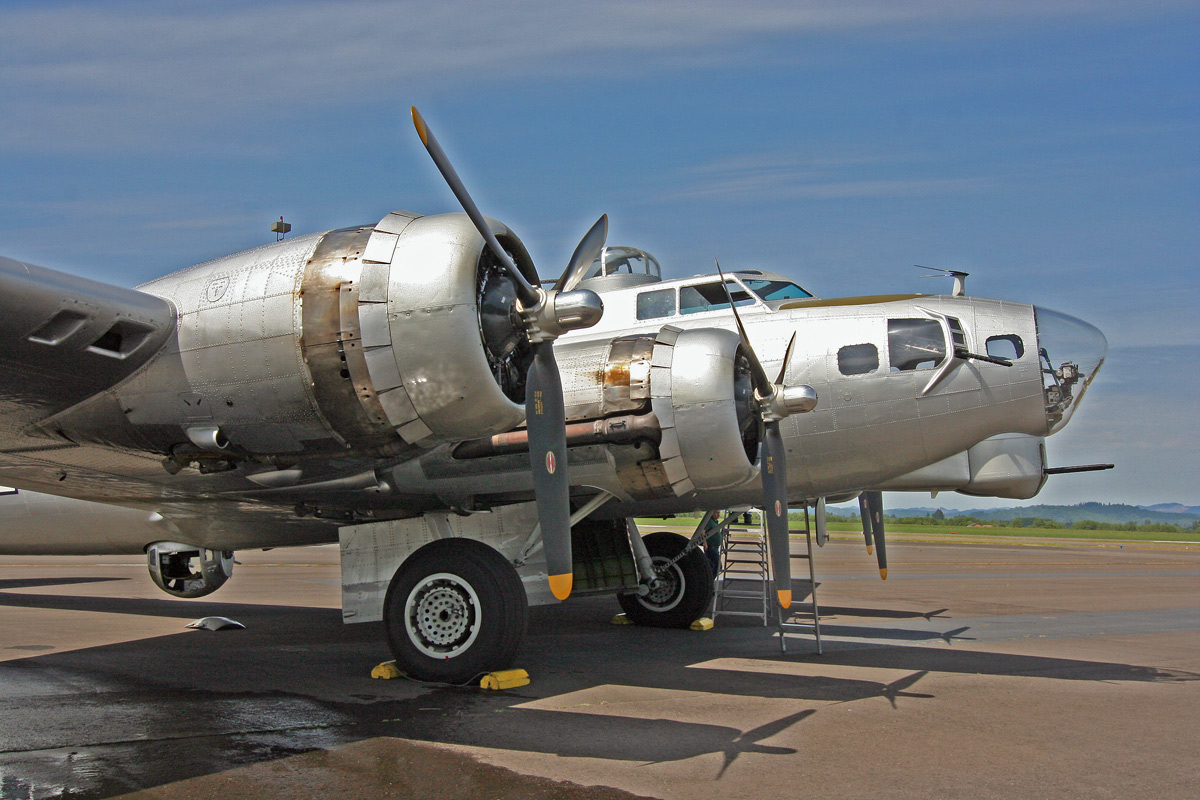 an old propeller plane with two propeller blades on the wing