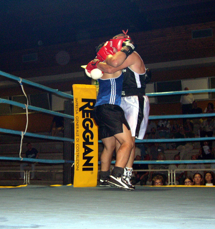 a person with a red boxing glove on top of his head