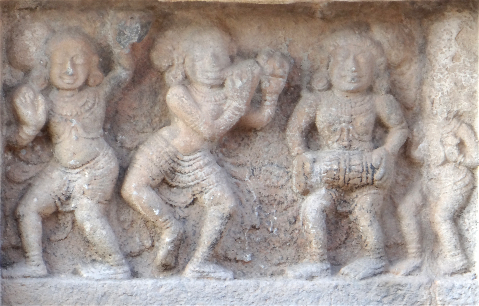 a carving depicting dancers performing a dance