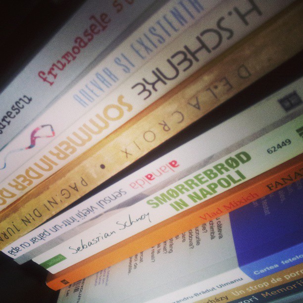 a stack of books with the top books in english and korean