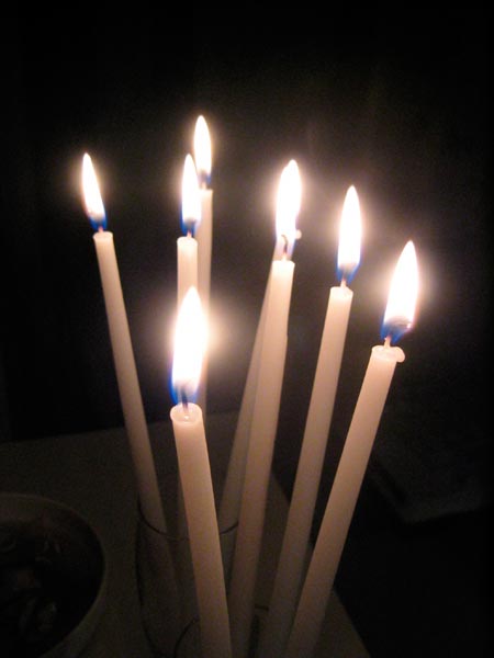 a candle with five white candles in it