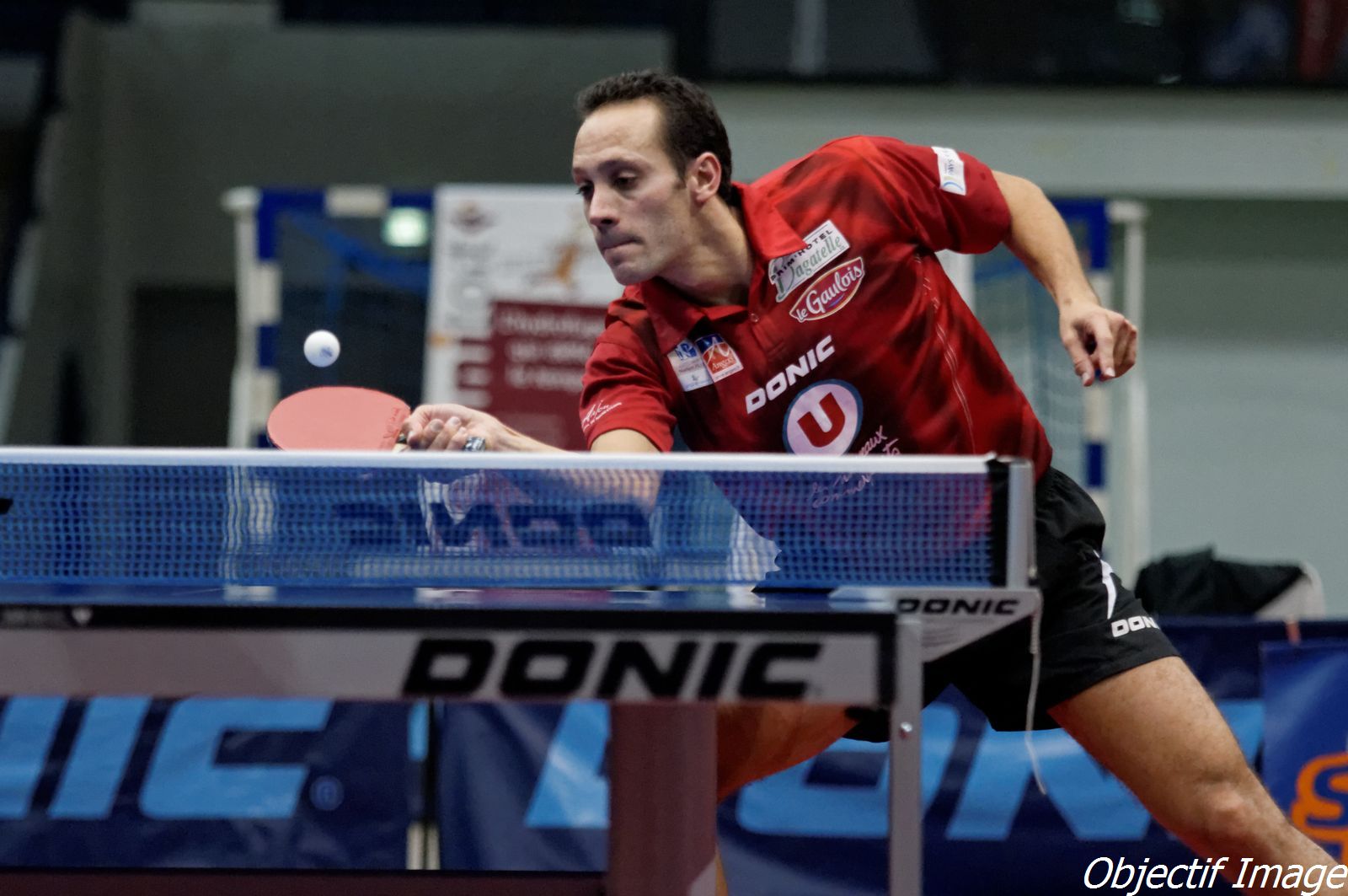 an image of a man that is playing table tennis