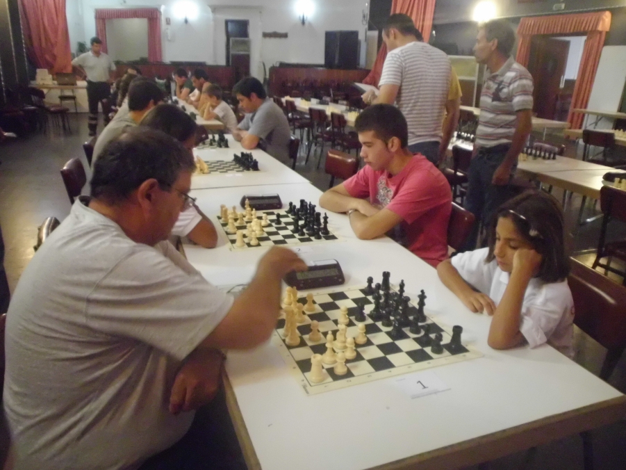 people are playing chess at an indoor event