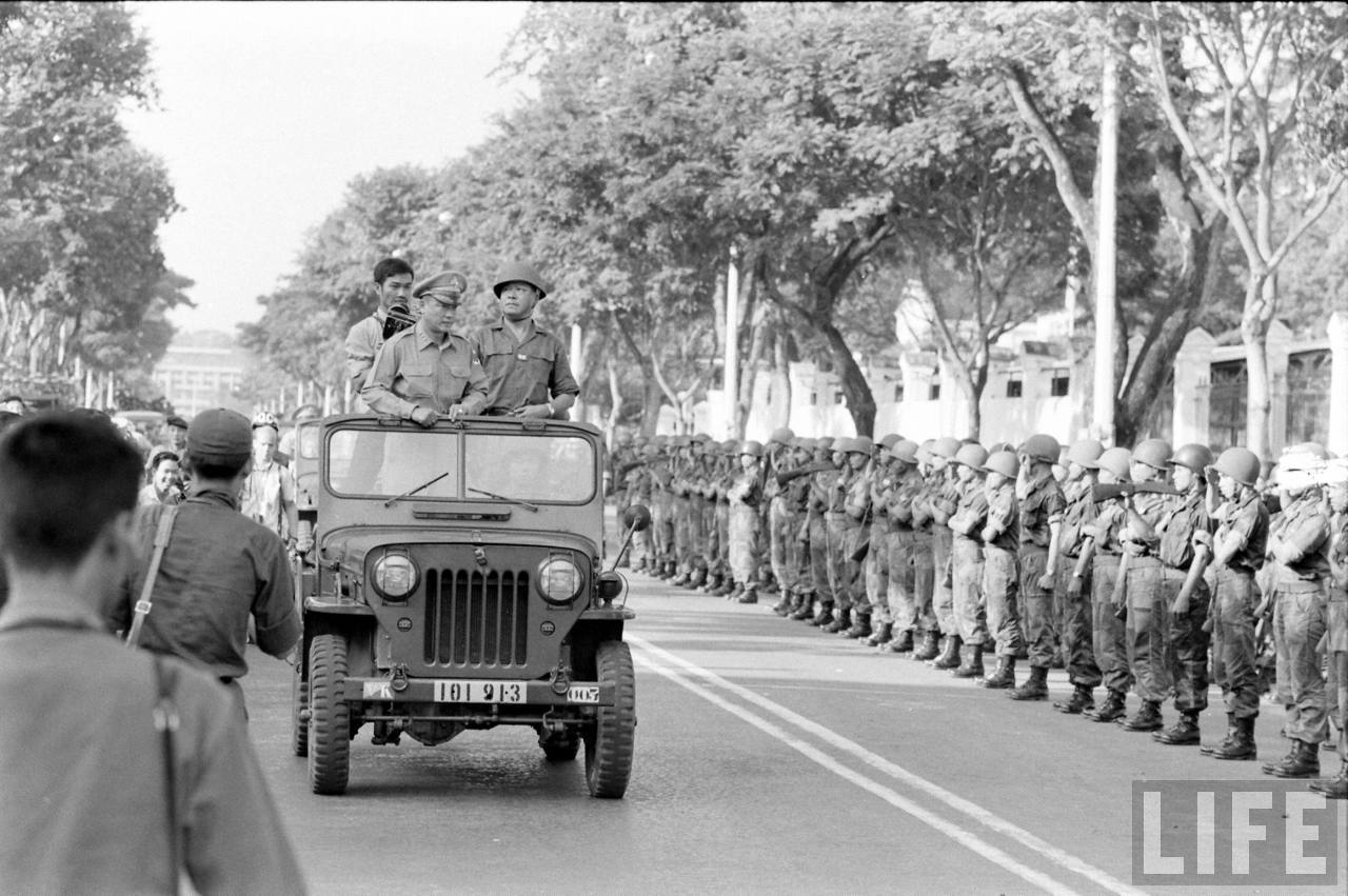 black and white pograph of military men lined up in a parade