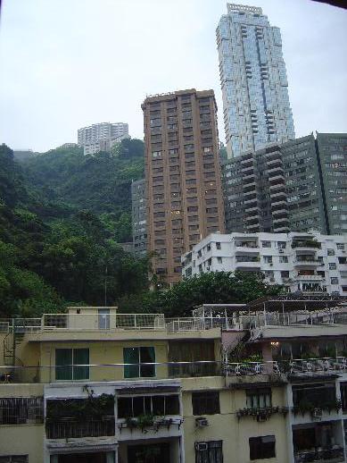 tall buildings are shown near one another in a city
