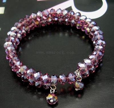 celet made of purple crystals with a little charm