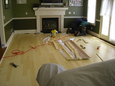 a living room being constructed with lots of wood